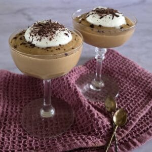 2 glasses filled with Hopjesvla, a Dutch dessert made of coffee custard.