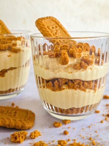 Layered Biscoff Dessert Cups, side shot so you can see the layers of speculoos cheesecake and the cookie crumbs.